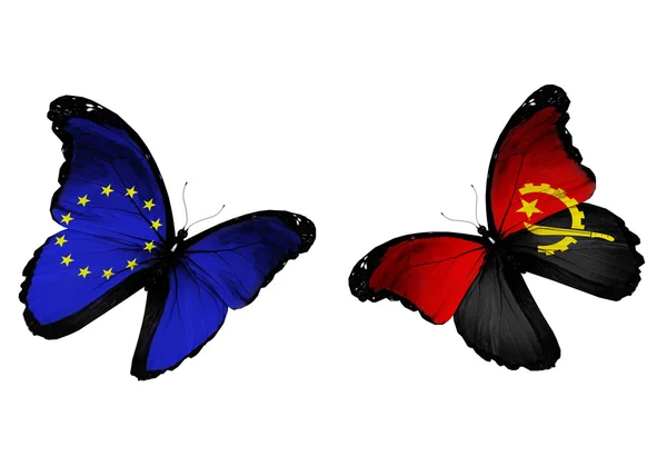 Концепція - два метелики з ЄС та Анголі прапорами, політ — стокове фото
