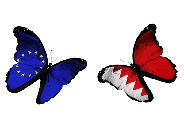 Concepto - dos mariposas con banderas de la UE y Bahréin ondeando —  Fotos de Stock