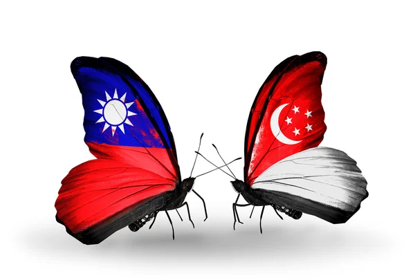 Butterflies with Taiwan and Singapore flags on wings — Stock Photo, Image
