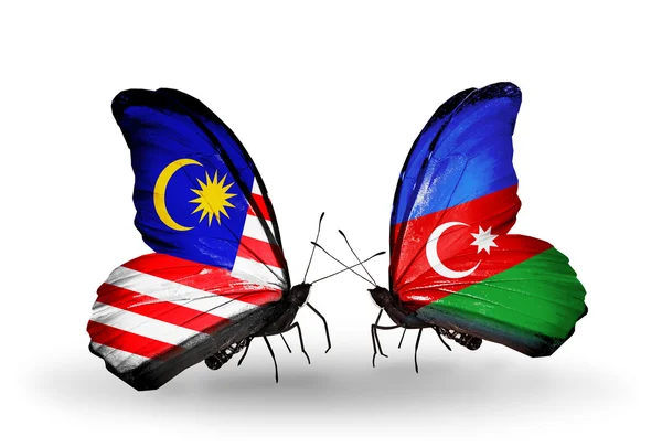 Schmetterlinge mit malaysischen und azerbaidschanischen Flaggen auf Flügeln — Stockfoto