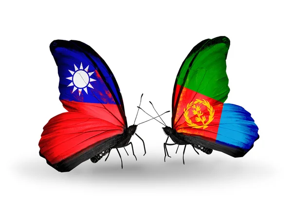 Motýli s Tchaj-wanem a eritrea vlajky na křídlech — Stock fotografie