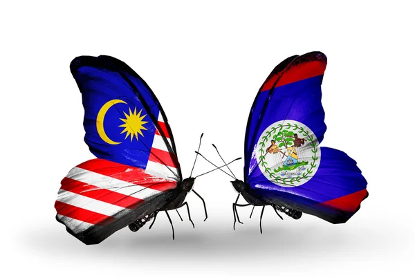 Borboletas com bandeiras da Malásia e Belize em asas — Fotografia de Stock