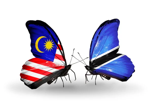 Butterflies with Malaysia and Botswana flags on wings — Stock Photo, Image