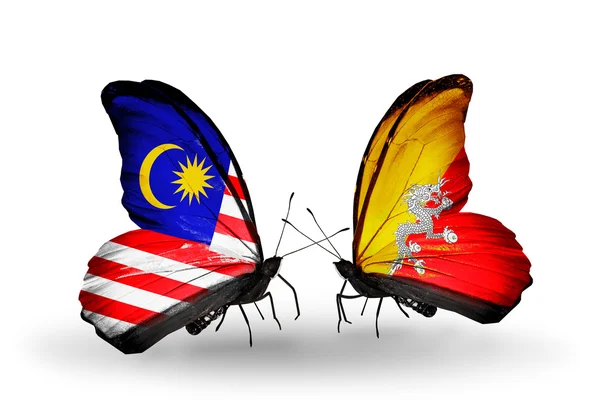 Butterflies with Malaysia and Bhutan flags on wings — Stock Photo, Image