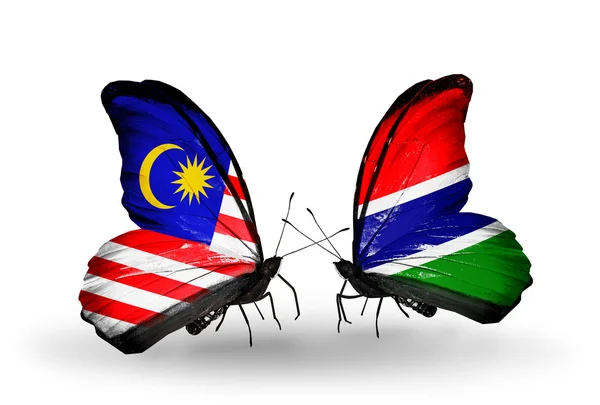 Butterflies with Malaysia and Gambia flags on wings — Stock Photo, Image