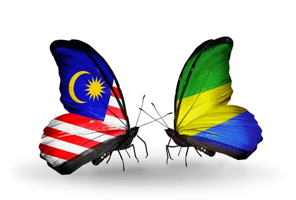 Butterflies with Malaysia and Gabon flags on wings — Stock Photo, Image