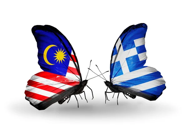 Vlinders met Maleisië en Griekenland vlaggen op vleugels — Stockfoto