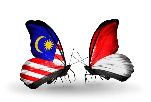 マレーシア、モナコ、翼の上のインドネシアのフラグと蝶 — ストック写真