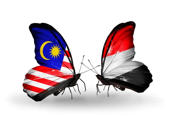 Butterflies with Malaysia and Yemen flags on wings — Stock Photo, Image