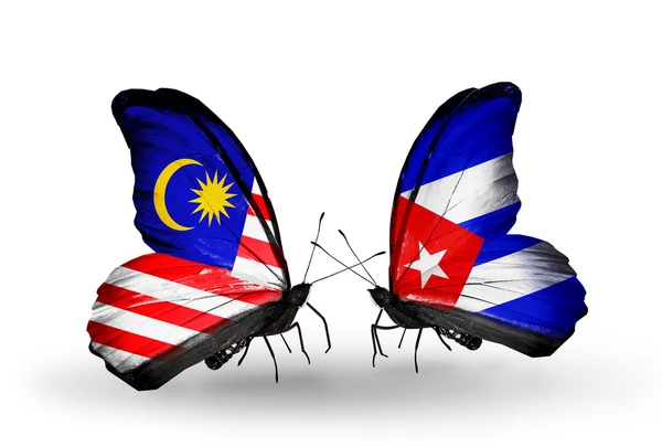 Butterflies with Malaysia and Cuba flags on wings — Stock Photo, Image