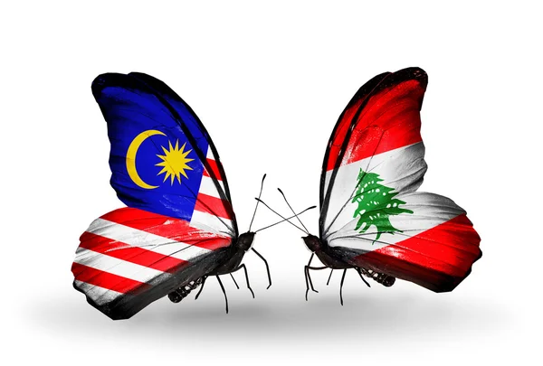 Fjärilar med malaysia och Libanon flaggor på vingar — Stockfoto