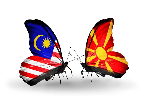 Kelebek kanatları üzerinde Malezya ve Makedonya bayraklı — Stok fotoğraf