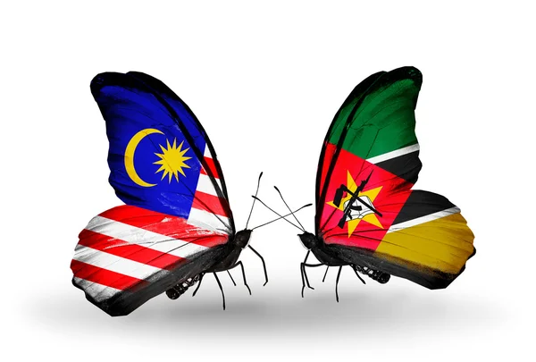 Butterflies with Malaysia and Mozambique flags on wings — Stock Photo, Image