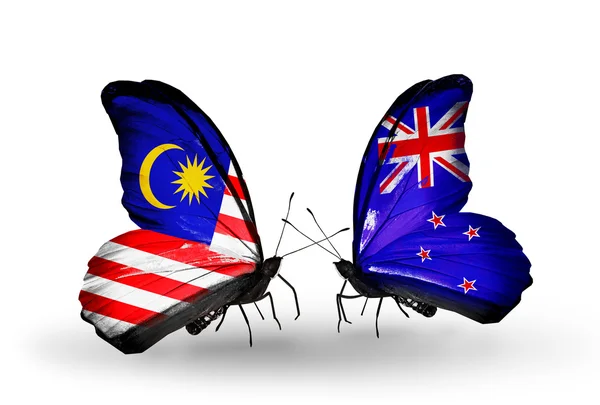 Borboletas com bandeiras da Malásia e Nova Zelândia em asas — Fotografia de Stock