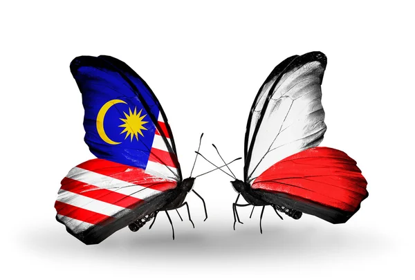 Butterflies with Malaysia and Poland flags on wings — Stock Photo, Image