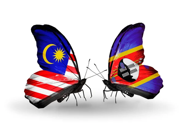 Butterflies with Malaysia and Swaziland flags on wings — Stock Photo, Image