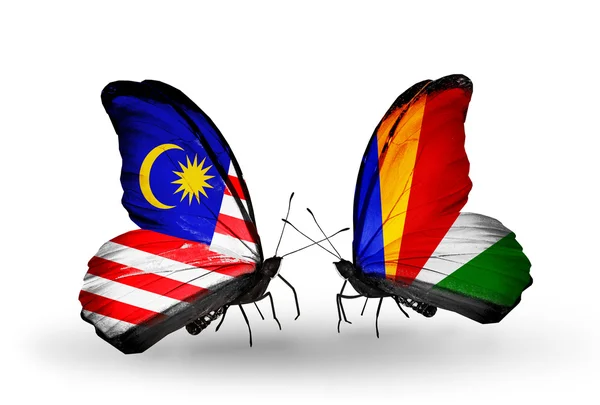 Butterflies with Malaysia and Seychelles flags on wings — Stock Photo, Image