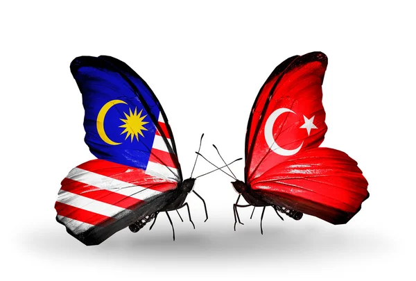 Butterflies with Malaysia and Turkey flags on wings — Stock Photo, Image