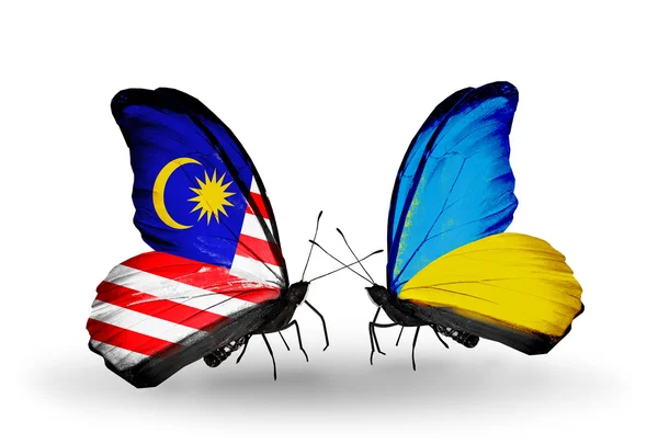 Butterflies with Malaysia and Ukraine flags on wings — Stock Photo, Image