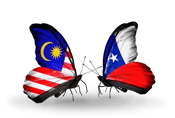 Butterflies with Malaysia and Chile flags on wings — Stock Photo, Image