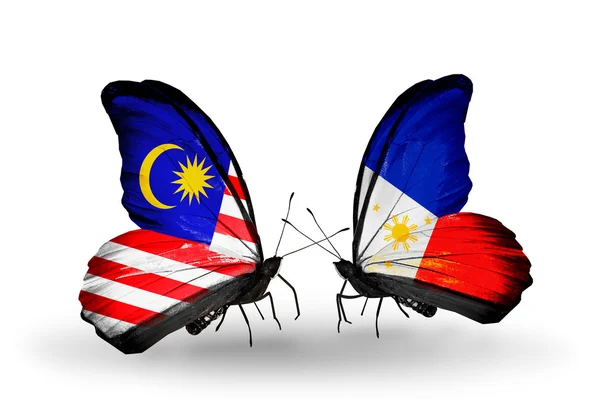 Vlinders met Maleisië en de Filipijnen vlaggen op vleugels — Stockfoto
