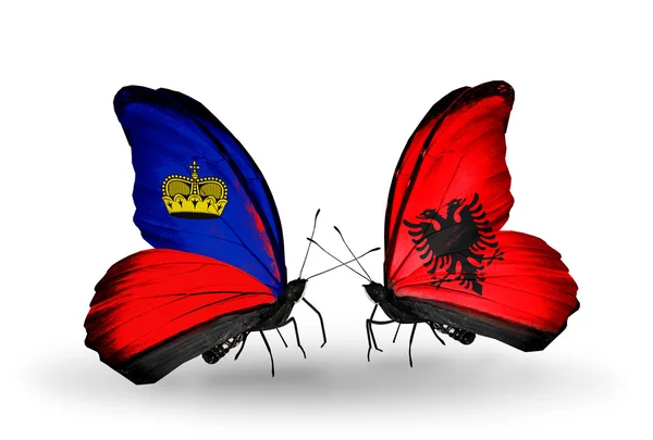 Butterflies with Liechtenstein and Albania flags on wings — Stock Photo, Image