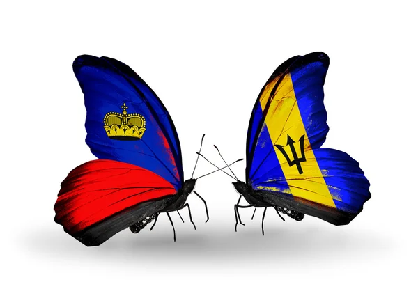 Farfalle con bandiere Liechtenstein e Barbados sulle ali — Foto Stock