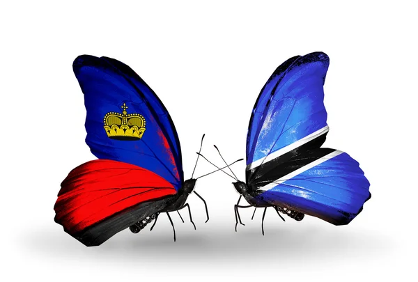 Farfalle con bandiere Liechtenstein e Botswana sulle ali — Foto Stock