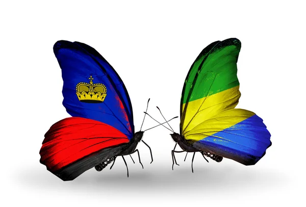 Butterflies with  Liechtenstein and Gabon flags on wings — Stock Photo, Image