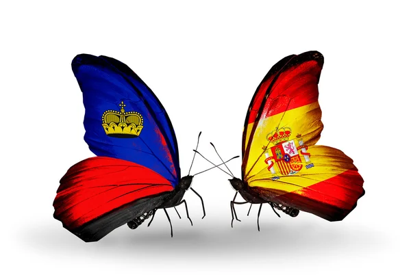 Mariposas con banderas de Liechtenstein y España en alas — Foto de Stock