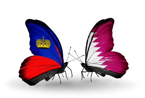 Borboletas com bandeiras do Liechtenstein e do Qatar em asas — Fotografia de Stock