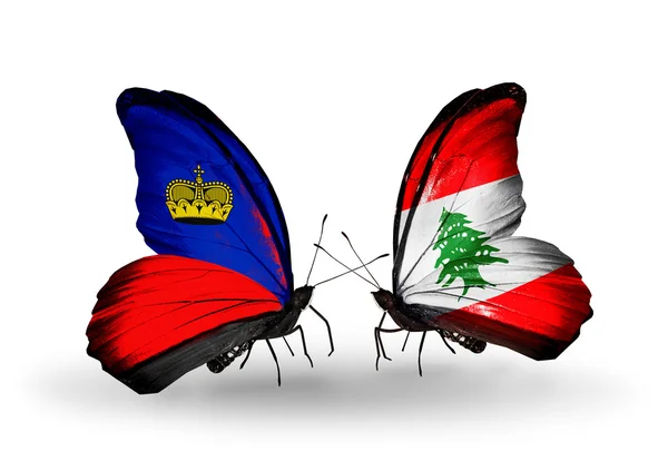 Farfalle con bandiere Liechtenstein e Libano sulle ali — Foto Stock