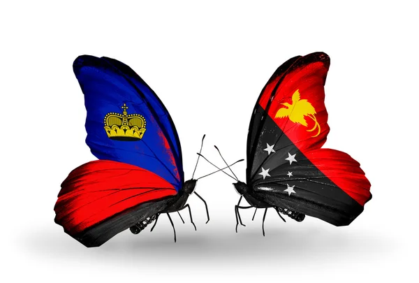 Бабочки с флагами Лихтенштейна и Папуа-Новой Гвинеи на крыльях — стоковое фото