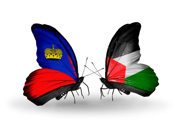 Farfalle con bandiere Liechtenstein e Palestina sulle ali — Foto Stock