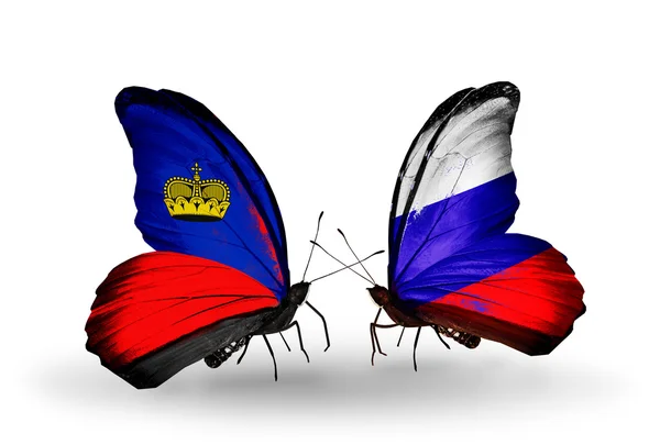 Mariposas con banderas de Liechtenstein y Rusia en alas — Foto de Stock