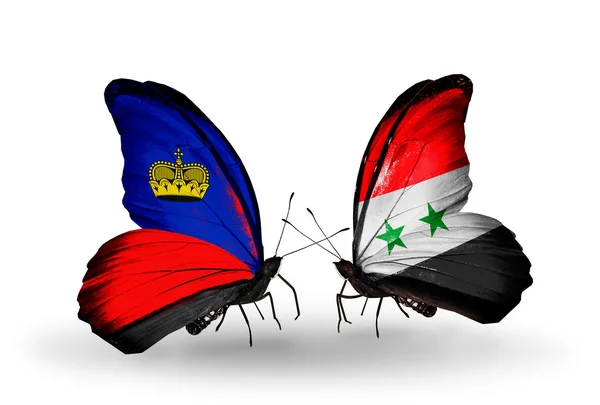 Borboletas com bandeiras do Liechtenstein e da Síria em asas — Fotografia de Stock