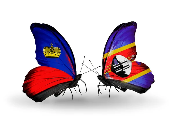 Butterflies with Liechtenstein and Swaziland flags on wings — Stock Photo, Image