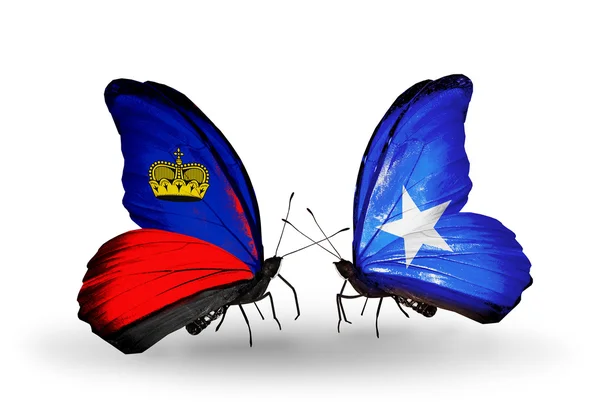 Motyle z Liechtensteinu oraz Somalii flagi na skrzydłach — Zdjęcie stockowe