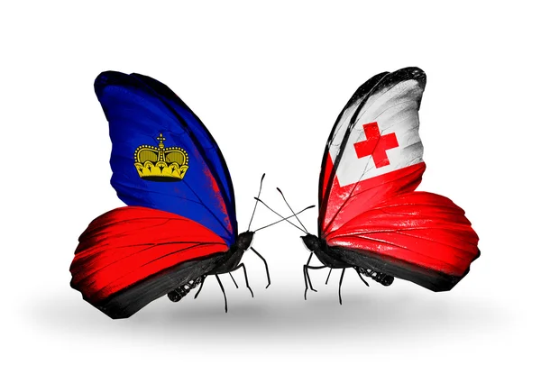 Papillons avec drapeaux Liechtenstein et Tonga sur les ailes — Photo