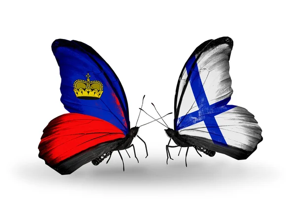 Butterflies with Liechtenstein and Finland flags on wings — Stock Photo, Image