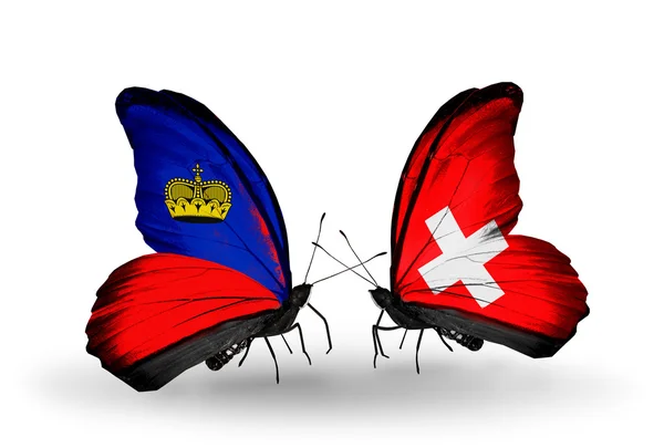 Papillons avec drapeaux Liechtenstein et Suisse sur les ailes — Photo