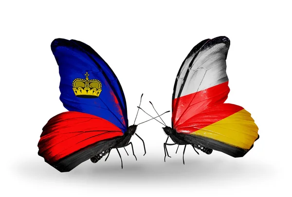 Butterflies with Liechtenstein and South Ossetia flags — Stock Photo, Image