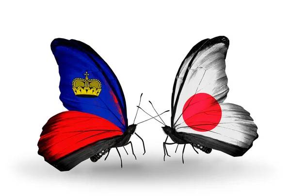 Бабочки с флагами Лихтенштейна и Японии — стоковое фото