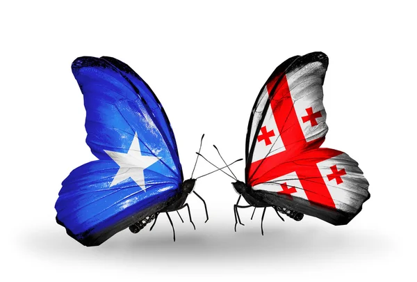 Бабочки с флагами Сомали и Грузии — стоковое фото
