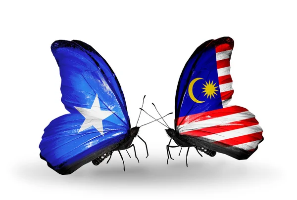 Fjärilar med Somalia och Malaysia flaggor på vingar — Stockfoto