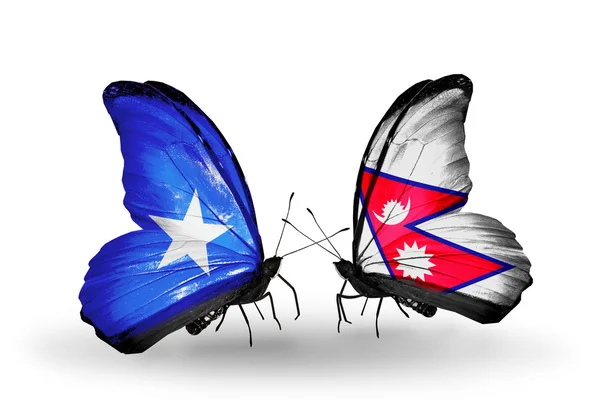 Mariposas con banderas de Somalia y Nepal en alas — Foto de Stock