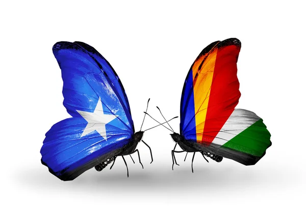 Mariposas con banderas de Somalia y Seychelles en alas — Foto de Stock