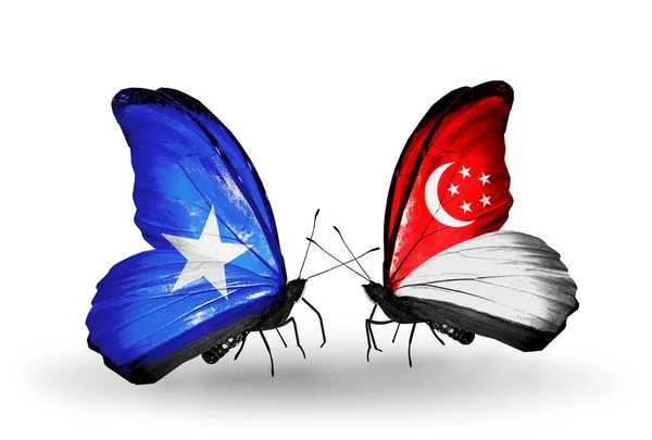 Πεταλούδες με τη Σομαλία και τη Σιγκαπούρη σημαίες με φτερά — Φωτογραφία Αρχείου