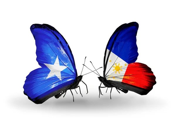 Fjärilar med Somalia och Filippinerna flaggor — Stockfoto