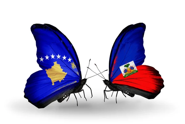 Butterflies with Kosovo and Haiti flags — Stock Photo, Image